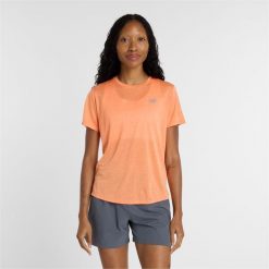 Koszulka damska New Balance WT41253AAE – pomarańczowa. Brązowe bluzki New Balance, l, bez wzorów, z materiału, sportowe, bez kołnierzyka, bez ramiączek. Za 199.99 zł.