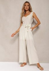 Jasnobeżowy Kombinezon z Wiskozy z Szerokimi Nogawkami z Gumką w Pasie i Materiałowym Paskiem Acladia. Brązowe sukienki Renee, l, bez wzorów, z materiału, eleganckie, bez kołnierzyka, bez ramiączek. Za 109.99 zł.