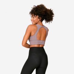 Stanik sportowy Decathlon crop top. Brązowe koszulki sportowe DECATHLON, bez wzorów, bez ramiączek, na jogę i pilates. Za 89.99 zł.