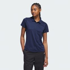 Koszulka polo Women's Solid Performance Short Sleeve. Niebieskie koszulki polo Adidas, s, bez wzorów, z materiału, bez kołnierzyka, bez ramiączek. Za 229.00 zł.