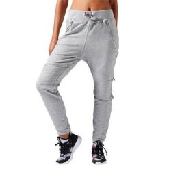 Spodnie sportowe damskie Reebok Dance Knit Moto. Szare spodnie sportowe Reebok, bez wzorów, z dresówki. Za 331.00 zł.