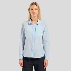 Koszula z długim rękawem damska ODLO Shirt l/s ESSENTIAL. Niebieskie koszule Odlo, l, bez wzorów, z materiału, klasyczne, bez kołnierzyka, bez ramiączek. Za 409.99 zł.