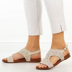 Beżowe płaskie sandały damskie M.Daszyński 1958-11. Brązowe sandały M.Daszyński, w ażurowe wzory, ze skóry, eleganckie, bez obcasa, na płaskiej podeszwie, bez zapięcia. Za 159.00 zł.