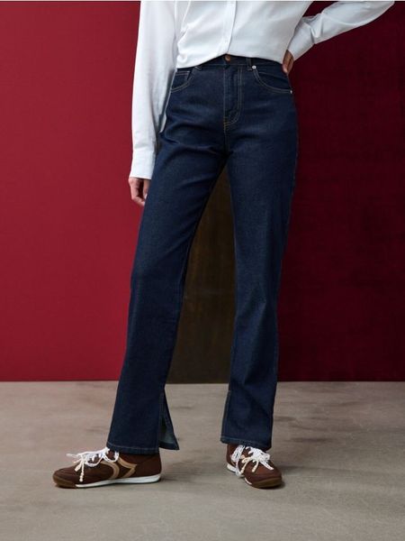 Jeansy straight z efektem sprania - granatowy. Niebieskie jeansy Sinsay, l, bez wzorów. Za 69.99 zł.