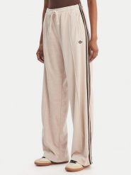 Adidas Spodnie dresowe Terry Towel Firebird KQ6661 Beżowy Loose Fit. Brązowe spodnie dresowe Adidas, xs, bez wzorów, z bawełny. Za 349.99 zł.