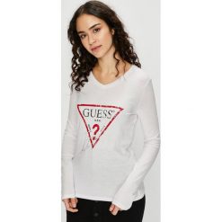 Guess Jeans - Bluzka. Białe bluzki Guess Jeans, l, z aplikacjami, z bawełny, bez kołnierzyka, bez ramiączek. W wyprzedaży za 119.90 zł.