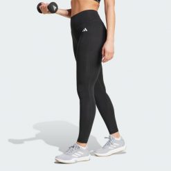 Długie legginsy Optimé Essentials Stash Pocket. Czarne legginsy Adidas, xl, bez wzorów, z elastanu, z podwyższonym stanem, długie. Za 157.99 zł.