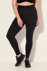 Damskie Legginsy sportowe LightFit kieszenie z recyklingu. Czarne legginsy sportowe Ulla Popken, plus size, bez wzorów, z elastanu, z podwyższonym stanem. Za 239.99 zł.