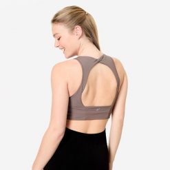 Stanik sportowy Decathlon crop top. Brązowe koszulki sportowe DECATHLON, bez wzorów, bez ramiączek, na jogę i pilates. Za 89.99 zł.