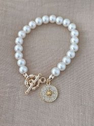 Nakkash Pozłacana bransoletka z cyrkoniami i szklanymi koralikami rozmiar: onesize. Białe bransoletki Nakkash, z cyrkonią, pozłacane. Za 39.99 zł.