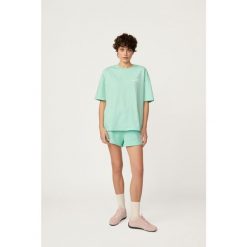 T-shirt Kubota miętowy damski. Zielone koszulki sportowe Kubota, bez wzorów, z materiału, bez ramiączek. W wyprzedaży za 59.99 zł.
