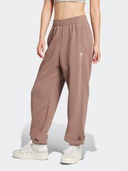 Adidas Spodnie dresowe w kolorze beżowym rozmiar: M. Brązowe spodnie dresowe Adidas, m, bez wzorów, z dresówki. Za 175.67 zł.