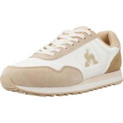 Kapcie LE COQ SPORTIF ASTRA_2 Jasnobrązowy. Brązowe obuwie domowe Le Coq Sportif, bez wzorów, z materiału, bez zapięcia. Za 365.00 zł.