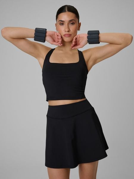 4F Crop top treningowy slim szybkoschnący damski - czarny L. Czarne topy 4f, l, bez wzorów, bez kołnierzyka, bez ramiączek. W wyprzedaży za 89.99 zł.