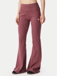 Adidas Legginsy Essentials KT4760 Różowy ciemny Flared Leg. Czerwone legginsy Adidas, s, bez wzorów, z wiskozy. Za 219.99 zł.