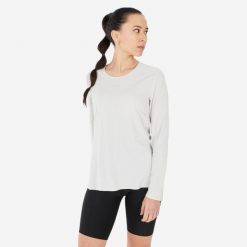 Koszulka turystyczna damska z długim rękawem Quechua MH500. Brązowe bluzki QUECHUA, xl, bez wzorów, z materiału, sportowe, bez kołnierzyka, bez ramiączek. Za 79.99 zł.