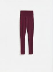 Gładkie legginsy - mahoniowy. Brązowe legginsy Reserved, l, bez wzorów, z dzianiny. Za 89.99 zł.