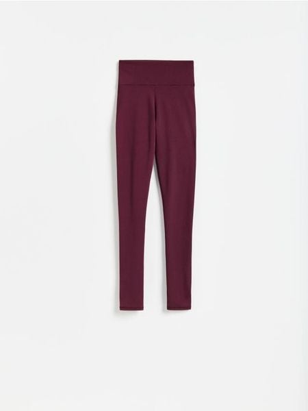 Gładkie legginsy - mahoniowy. Brązowe legginsy Reserved, l, bez wzorów, z dzianiny. Za 89.99 zł.