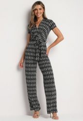 Czarny Taliowany Kombinezon z Wiskozą Krótkim Rękawem i Długimi Nogawkami Wiązany w Talii Jeleavia. Czarne sukienki Born2be, na spotkanie biznesowe, na lato, l, bez wzorów, z wiskozy, eleganckie, bez kołnierzyka, bez ramiączek, mini, kopertowe. Za 139.99 zł.