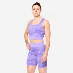 Koszulka fitness damska Domyos crop top. Fioletowe topy DOMYOS, xs, bez wzorów, z elastanu, bez kołnierzyka, bez ramiączek. W wyprzedaży za 69.99 zł.