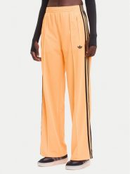 Adidas Spodnie dresowe adicolor Classic Firebird JY2694 Żółty Loose Fit. Żółte spodnie dresowe Adidas, xl, bez wzorów, z dresówki. Za 299.99 zł.