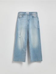 Jeansy wide leg z przetarciami - niebieski. Niebieskie jeansy Reserved, bez wzorów. W wyprzedaży za 49.99 zł.