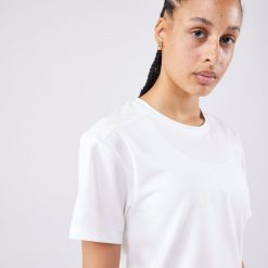 Koszulka tenisowa krótki rękaw damska Artengo Crop Top DRY. Białe bluzki ARTENGO, s, bez wzorów, z elastanu, sportowe, bez kołnierzyka, bez ramiączek. W wyprzedaży za 69.99 zł.