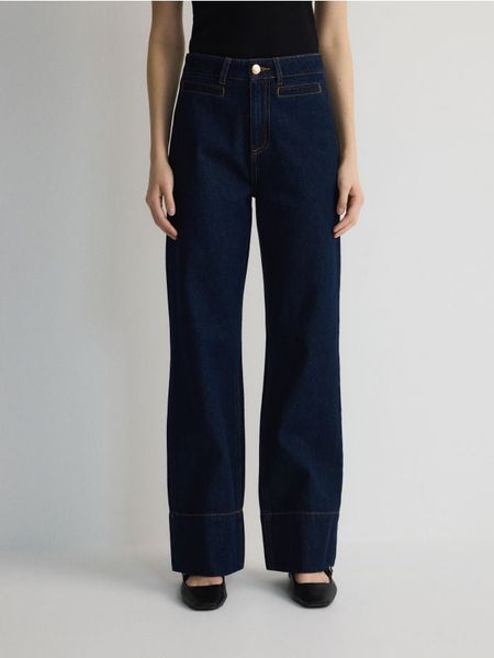Jeansy wide leg - granatowy. Niebieskie jeansy Reserved, bez wzorów. W wyprzedaży za 99.99 zł.