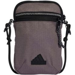 Torebka adidas Xplorer Small - 0,46 l, brązowa. Brązowe torby na ramię Adidas, bez wzorów, z materiału, na ramię, bez dodatków. Za 75.99 zł.