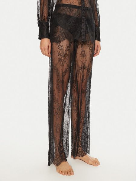 Hunkemöller Spodnie materiałowe Camille 300598 Czarny Relaxed Fit. Czarne spodnie materiałowe Hunkemöller, l, bez wzorów, z materiału. Za 99.99 zł.