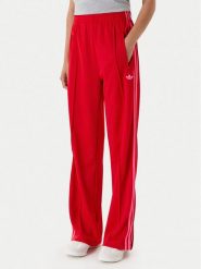 Adidas Spodnie dresowe adicolor Classic Firebird JW1225 Czerwony Loose Fit. Czerwone spodnie dresowe Adidas, xl, bez wzorów, z dresówki. Za 299.99 zł.