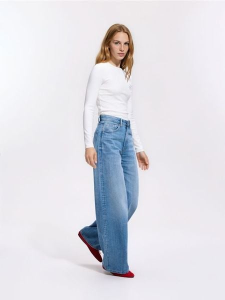 Jeansy wide leg z wysokim stanem - niebieski. Niebieskie jeansy Reserved, bez wzorów, z podwyższonym stanem. Za 139.99 zł.