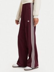 Adidas Spodnie dresowe Adicolor Classic Firebird KA7743 Brązowy Loose Fit. Brązowe spodnie dresowe Adidas, l, bez wzorów, z dresówki. Za 299.99 zł.