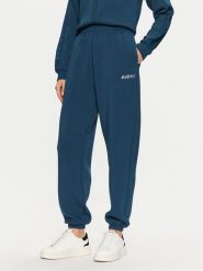 Guess Spodnie dresowe V4BB13 K7UW2 Niebieski Regular Fit. Niebieskie spodnie dresowe Guess, m, z aplikacjami, z dresówki. Za 199.99 zł.