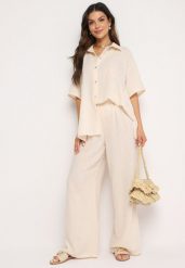 Beżowy Komplet 2-Częściowy Koszula o Luźnym Kroju Szerokie Spodnie z Gumką w Talii Vimitha. Brązowe koszule Born2be, uniwersalny, z aplikacjami, z materiału, bez kołnierzyka, bez ramiączek. Za 149.99 zł.