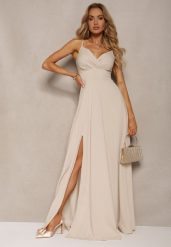 Beżowa Elegancka Sukienka o Rozkloszowanym Kroju z Rozcięciem na Ramiączkach z Kopertowym Dekoltem Winelia. Brązowe sukienki Renee, na imprezę, l, bez wzorów, eleganckie, bez kołnierzyka, dla wysokich, bez ramiączek, maxi, kopertowe. Za 149.99 zł.