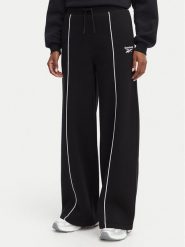 Reebok Spodnie dresowe Oliwia RK25683CCW Czarny Regular Fit. Czarne spodnie dresowe Reebok, xs, bez wzorów, z dresówki. Za 199.99 zł.