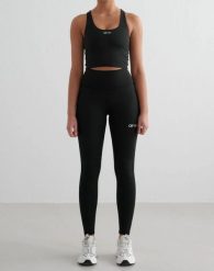 Damskie legginsy z wysokim stanem, squat proof, z tylną kieszenią Core czarne. Czarne legginsy AIM'N, xl, bez wzorów, z elastanu, z podwyższonym stanem, długie. Za 304.00 zł.