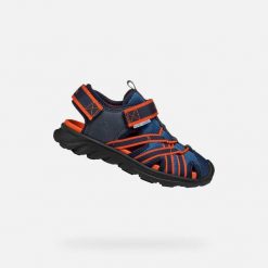 Sandały Geox Model J Sandal Airadyum Bo Kolor Niebieski. Czerwone sandały Geox, bez wzorów, z syntetyku, bez obcasa, bez zapięcia. Za 276.59 zł.