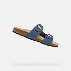 Sandały GEOX D BRIONIA Niebieski. Niebieskie sandały Geox, bez wzorów, ze skóry, bez obcasa, bez zapięcia. Za 263.99 zł.