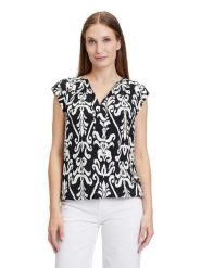 CARTOON Bluzka w kolorze biało-czarnym rozmiar: 44. Białe bluzki Cartoon, bez wzorów, z wiskozy, bez kołnierzyka, bez ramiączek. Za 104.99 zł.