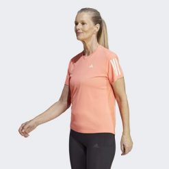 Koszulka do biegania damska Adidas Own the Run Tee. Brązowe bluzki Adidas, xs, bez wzorów, z materiału, sportowe, bez kołnierzyka, bez ramiączek. W wyprzedaży za 123.40 zł.