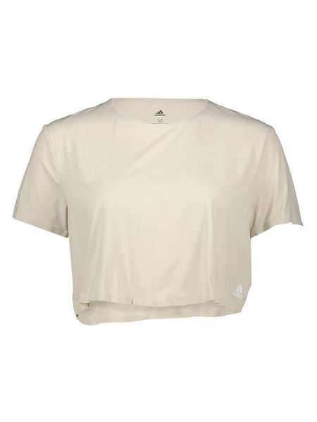 Adidas Koszulka sportowa "Elev TRNG" w kolorze beżowym rozmiar: L. Brązowe koszulki sportowe Adidas, bez wzorów, z materiału, bez ramiączek, outdoorowe. Za 87.40 zł.