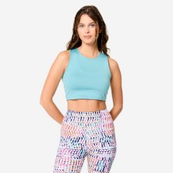Koszulka fitness damska Domyos bez rękawów crop top. Niebieskie koszulki sportowe DOMYOS, bez wzorów, z elastanu, bez ramiączek, na fitness i siłownię. Za 34.99 zł.