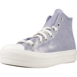 Kapcie CONVERSE Chuck Taylor All Star Lift Platform Suede Shimmer Hi Fioletowy. Fioletowe obuwie domowe Converse, bez wzorów, ze skóry, bez zapięcia. Za 288.99 zł.