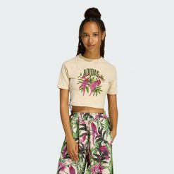KOSZULKA ADIDAS x FARM RIO GRAPHIC T-SHIRT CROPPED. Białe bluzki Adidas, bez wzorów, bez kołnierzyka, bez ramiączek. Za 149.00 zł.