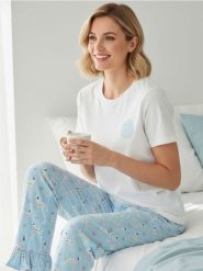 Piżama dwuczęściowa z motywem dalmatyńczyków - niebieski. Niebieskie piżamy Sinsay, bez wzorów, bez ramiączek. Za 49.99 zł.