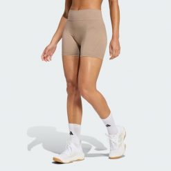 Legginsy Workout Essentials 4 inch. Brązowe legginsy Adidas, bez wzorów. Za 129.00 zł.