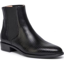 Sztyblety UNISA - Belki F19 Btj Black. Czarne botki Unisa, bez wzorów, ze skóry, bez obcasa, na obcasie, bez zapięcia. Za 549.00 zł.