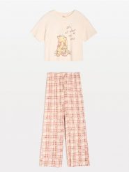 Bawełniana piżama dwuczęściowa Winnie the Pooh - kremowy. Białe piżamy Sinsay, bez wzorów, z bawełny, bez ramiączek. Za 59.99 zł.